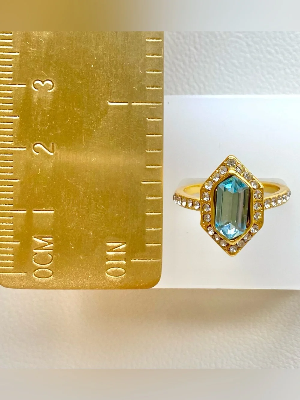 Gold Ring with Blue Gemstone and Clear Accent Stones